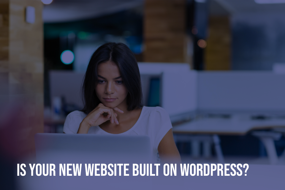 Woman looking at screen with text "is your new website built with wordpress?"